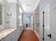 Elegant bathroom with and vanities and walk-in shower at 2001 Bett Mar Ln, Winter Park, FL 32789
