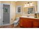 Well-lit bathroom featuring a glass-enclosed shower and a wooden vanity with granite countertops at 2001 Bett Mar Ln, Winter Park, FL 32789