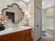 Well decorated bathroom with marble countertops, patterned wallpaper, and vanity at 2001 Bett Mar Ln, Winter Park, FL 32789
