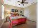 Comfortable bedroom featuring a wooden bed frame, a ceiling fan, and a window at 2001 Bett Mar Ln, Winter Park, FL 32789
