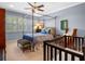 Sunlit bedroom with canopy bed and a crib at 2001 Bett Mar Ln, Winter Park, FL 32789