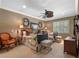 Bright bedroom with twin beds, ceiling fan, and shuttered windows at 2001 Bett Mar Ln, Winter Park, FL 32789
