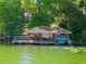 Lakefront property with a covered boat dock and lift for easy water access at 2001 Bett Mar Ln, Winter Park, FL 32789