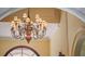 Elegant, multi-tiered chandelier illuminating the home's foyer at 2001 Bett Mar Ln, Winter Park, FL 32789