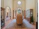 Grand dining room with tall ceilings, decorative chandelier, and large windows with custom drapes at 2001 Bett Mar Ln, Winter Park, FL 32789