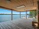Covered boat dock showcasing stunning lake views, bench seating, and a sturdy wooden structure at 2001 Bett Mar Ln, Winter Park, FL 32789