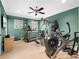 Home gym with ceiling fan, multiple exercise machines and lots of natural light at 2001 Bett Mar Ln, Winter Park, FL 32789