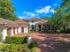 Beautiful two-story home featuring a brick driveway, manicured landscaping, and a classic architectural style at 2001 Bett Mar Ln, Winter Park, FL 32789