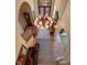 Grand foyer featuring a beautiful chandelier, arched doorways, and tile flooring at 2001 Bett Mar Ln, Winter Park, FL 32789