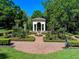 Exquisite garden featuring symmetrical landscaping, a charming gazebo, and a peaceful ambiance at 2001 Bett Mar Ln, Winter Park, FL 32789