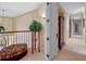 Upstairs landing and hallway with plant stand at 2001 Bett Mar Ln, Winter Park, FL 32789