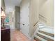 Hallway featuring tile flooring, closet and stairs at 2001 Bett Mar Ln, Winter Park, FL 32789
