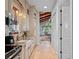 Well-lit kitchen with white cabinets, granite countertops, stainless steel appliances, and hardwood floors at 2001 Bett Mar Ln, Winter Park, FL 32789