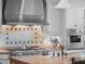 Gourmet kitchen with professional-grade range and stainless steel appliances at 2001 Bett Mar Ln, Winter Park, FL 32789