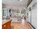 Open kitchen with white cabinets, stainless steel appliances, and tile floors at 2001 Bett Mar Ln, Winter Park, FL 32789