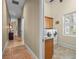 Laundry room featuring laundry machines, tile flooring, window, and hallway access at 2001 Bett Mar Ln, Winter Park, FL 32789