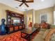 Cozy living room featuring a large entertainment center, comfortable seating, and ample natural light at 2001 Bett Mar Ln, Winter Park, FL 32789