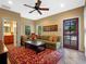 Comfortable living room with a plush sofa, decorative rug, and plenty of natural light, perfect for relaxation at 2001 Bett Mar Ln, Winter Park, FL 32789