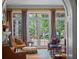 Serene living room featuring French doors that open to a beautifully landscaped outdoor area at 2001 Bett Mar Ln, Winter Park, FL 32789