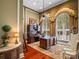 Spacious office featuring hardwood floors, large windows, and an ornate wooden desk with ceiling fan at 2001 Bett Mar Ln, Winter Park, FL 32789
