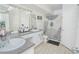 Bathroom featuring double sinks and a shower with stylish curtain at 204 E South St # 2061, Orlando, FL 32801
