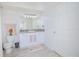 Bright bathroom with a single sink vanity, modern lighting, and tile floors at 204 E South St # 2061, Orlando, FL 32801