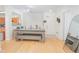 Open concept dining room with wood floors and modern table at 204 E South St # 2061, Orlando, FL 32801