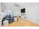 Comfortable living room with a dark sofa and adjacent balcony at 204 E South St # 2061, Orlando, FL 32801
