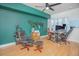 Well-lit office space with a green accent wall, wooden floors, and a work area at 204 E South St # 2061, Orlando, FL 32801
