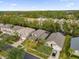 Aerial view of a charming neighborhood with mature trees and well-kept lawns at 213 Hideaway Beach Ln, Kissimmee, FL 34746