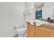 Cozy bathroom with white toilet, sink and shower with a shark curtain at 213 Hideaway Beach Ln, Kissimmee, FL 34746