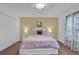 Cozy bedroom featuring soft bedding, a decorative headboard, and ample closet space at 213 Hideaway Beach Ln, Kissimmee, FL 34746