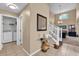 Welcoming entryway with stylish decor, stairs, and access to the laundry room at 213 Hideaway Beach Ln, Kissimmee, FL 34746
