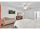 Comfortable main bedroom showcasing a plush chaise lounge and a dresser at 213 Hideaway Beach Ln, Kissimmee, FL 34746