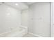 All-white bathroom with updated tiles and fixtures at 2309 Sun Valley Cir # 2309, Winter Park, FL 32792