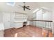 A bedroom with built-in desk and shelving, ceiling fan and skylights allowing natural light at 2309 Sun Valley Cir # 2309, Winter Park, FL 32792
