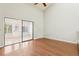 A bedroom features sliding glass doors which leads to a sunroom at 2309 Sun Valley Cir # 2309, Winter Park, FL 32792