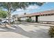 Exterior shot of the home with well-maintained landscaping and a dedicated parking space at 2309 Sun Valley Cir # 2309, Winter Park, FL 32792