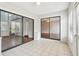 Bright Florida room featuring tile floors and large sliding glass doors leading inside at 2309 Sun Valley Cir # 2309, Winter Park, FL 32792