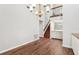 Bright living area boasts high ceilings, a staircase, and an adjacent wet bar, perfect for entertaining at 2309 Sun Valley Cir # 2309, Winter Park, FL 32792