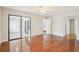 Spacious main bedroom with wood floors, a ceiling fan, and sliding glass doors at 2309 Sun Valley Cir # 2309, Winter Park, FL 32792