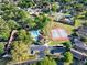 Aerial view of community pool and tennis courts at 237 S Wilderness Pt, Casselberry, FL 32707
