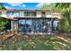 View of the backyard featuring a screened-in lanai at 237 S Wilderness Pt, Casselberry, FL 32707