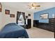 Well-lit bedroom featuring blue walls and a large window at 237 S Wilderness Pt, Casselberry, FL 32707