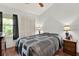 Cozy bedroom with soft lighting and a large window at 237 S Wilderness Pt, Casselberry, FL 32707