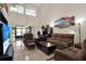 Bright living room featuring high ceilings and a sliding door to the patio at 237 S Wilderness Pt, Casselberry, FL 32707