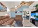 Open living space with staircase, neutral colors, and plenty of natural light at 237 S Wilderness Pt, Casselberry, FL 32707