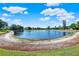 Scenic view of the pond with lush green surroundings at 237 S Wilderness Pt, Casselberry, FL 32707