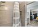 Updated bathroom with modern tile and decorative shower curtain at 239 Hill St # 239, Casselberry, FL 32707