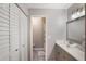 Bathroom with white vanity, updated fixtures, and a view of the shower/tub combo at 239 Hill St # 239, Casselberry, FL 32707